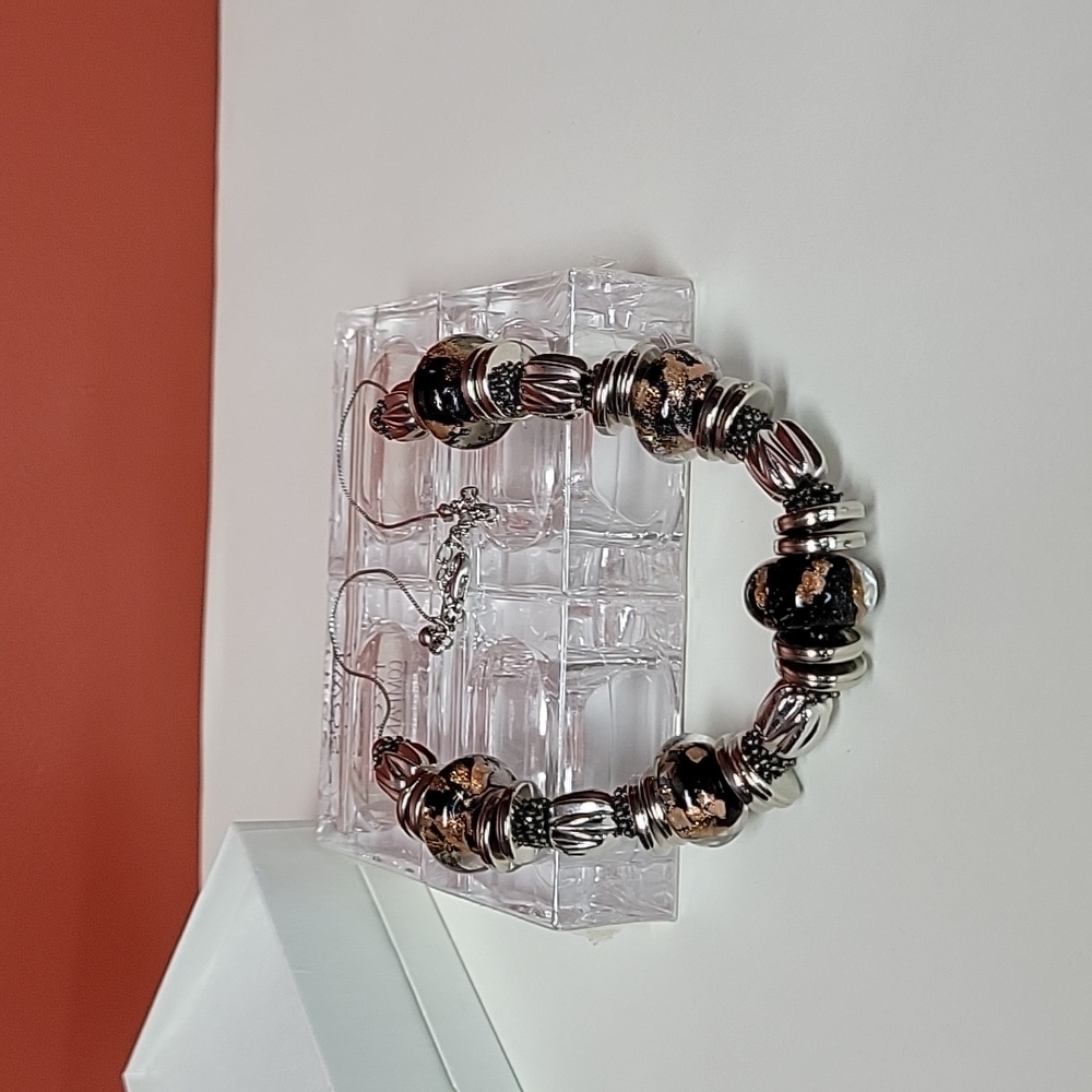 Beautiful glass bead necklace. Copper,black and silver colors.
